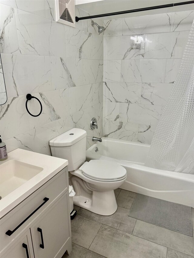full bath with tile walls, vanity, shower / bathtub combination with curtain, and toilet