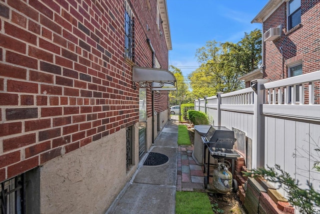 143-07 Rose Ave, Flushing, NY 11355 - view of side of home featuring brick siding and cooling unit