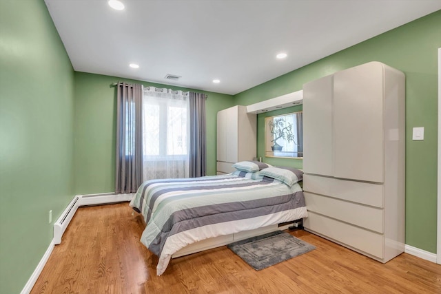 143-07 Rose Ave, Flushing, NY 11355 - bedroom featuring baseboards, wood finished floors, and recessed lighting