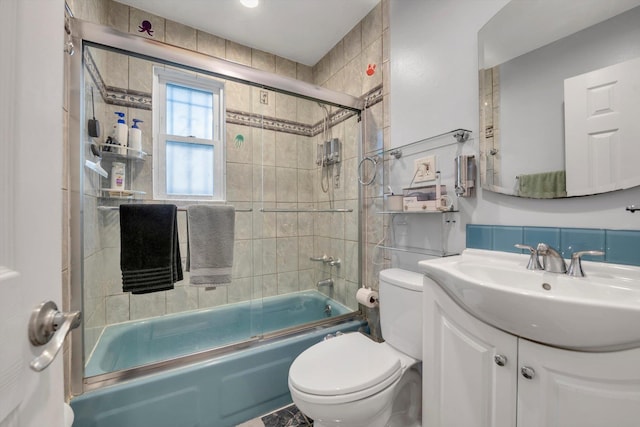 143-07 Rose Ave, Flushing, NY 11355 - bathroom featuring combined bath / shower with glass door, toilet, and vanity