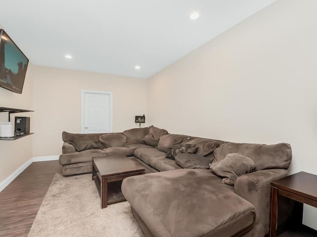 living area featuring recessed lighting, wood finished floors, and baseboards