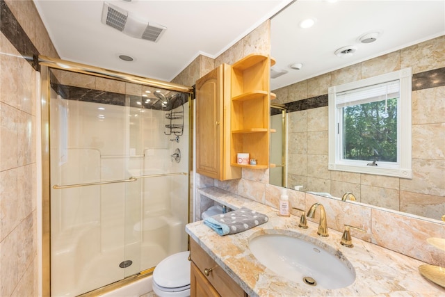 full bath featuring vanity, backsplash, toilet, and a shower stall