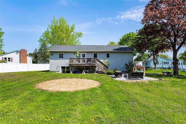 back of house with a yard, fence, stairs, a patio area, and a deck