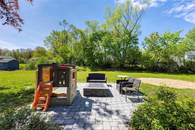 view of patio with a fire pit