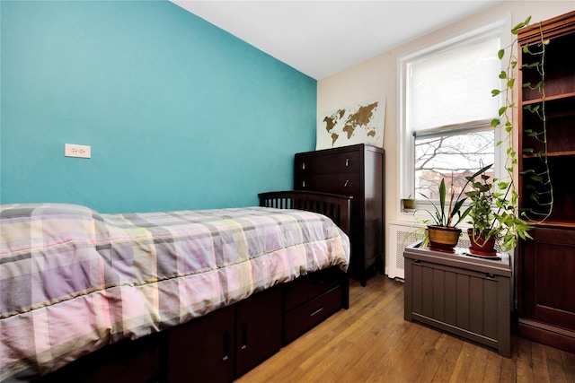 bedroom with light wood finished floors
