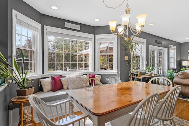 dining area featuring wood finished floors, a chandelier, and recessed lighting