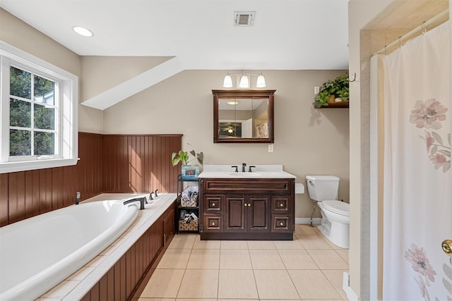 full bathroom with tile patterned flooring, toilet, vanity, visible vents, and a garden tub