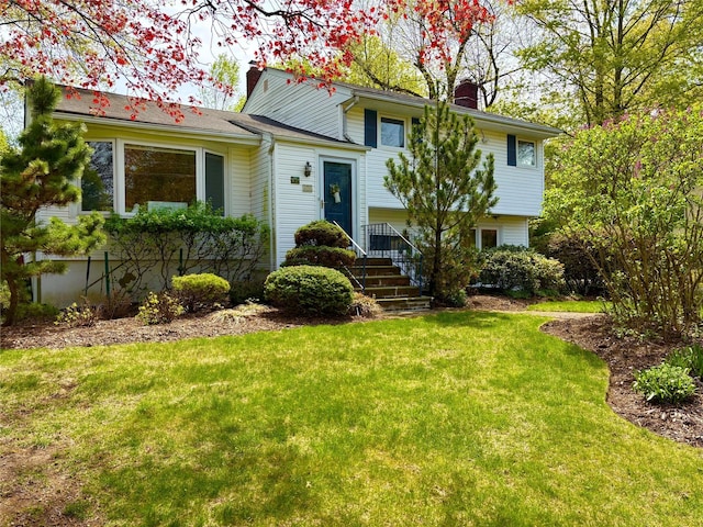 103 S Nauraushaun Rd, Pearl River, NY 10965 - tri-level home featuring a front yard and a chimney