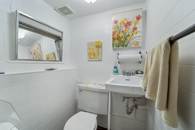 103 S Nauraushaun Rd, Pearl River, NY 10965 - bathroom with toilet, a sink, tile walls, and visible vents