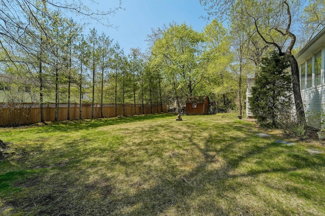 103 S Nauraushaun Rd, Pearl River, NY 10965 - view of yard with fence, a storage unit, and an outbuilding
