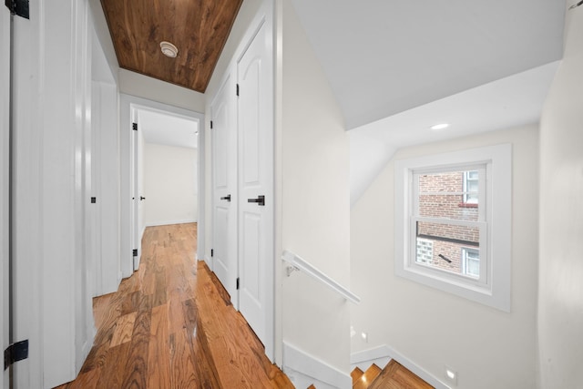 13107 229th St, Laurelton, NY 11413 - hall with light wood-type flooring, baseboards, recessed lighting, and an upstairs landing