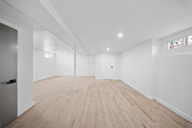13107 229th St, Laurelton, NY 11413 - below grade area featuring light wood-type flooring, baseboards, recessed lighting, and a healthy amount of sunlight
