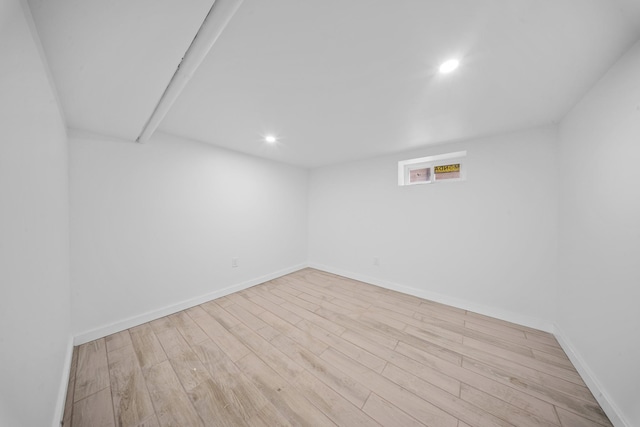 13107 229th St, Laurelton, NY 11413 - basement with baseboards, wood finished floors, and recessed lighting