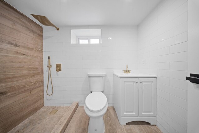 13107 229th St, Laurelton, NY 11413 - full bathroom featuring a tile shower, wood finished floors, toilet, and vanity