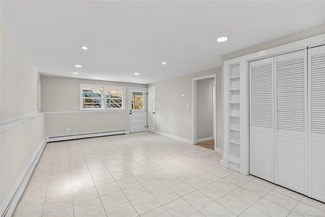 interior space featuring a baseboard radiator and recessed lighting