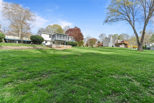 view of yard with a sunroom