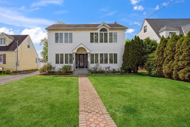 44 Netz Pl, Albertson, NY 11507 - colonial-style house featuring a front lawn
