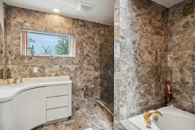 44 Netz Pl, Albertson, NY 11507 - full bathroom with tile walls, vanity, a bath, a stall shower, and visible vents
