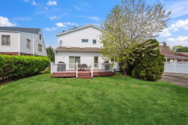 44 Netz Pl, Albertson, NY 11507 - rear view of property featuring a wooden deck and a yard