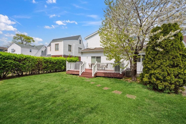 44 Netz Pl, Albertson, NY 11507 - back of property featuring a wooden deck and a lawn