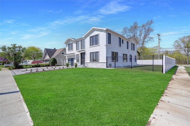 view of front of property featuring stucco siding, stone siding, a front lawn, and fence