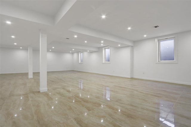 below grade area featuring recessed lighting and baseboards