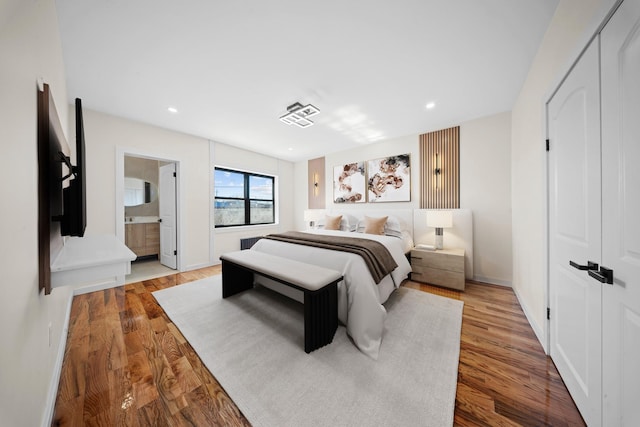 22518 Mentone Ave, Laurelton, NY 11413 - bedroom featuring baseboards, wood finished floors, and recessed lighting