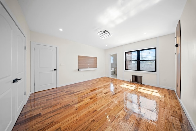 22518 Mentone Ave, Laurelton, NY 11413 - interior space with radiator, light wood-style floors, baseboards, and recessed lighting