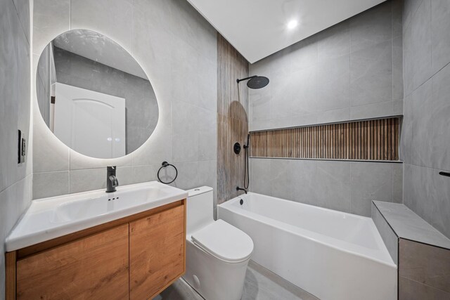 22518 Mentone Ave, Laurelton, NY 11413 - bathroom with tile walls, toilet, vanity, and  shower combination