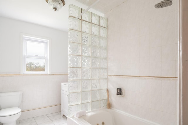 full bath featuring a whirlpool tub, tiled shower, tile patterned flooring, and tile walls