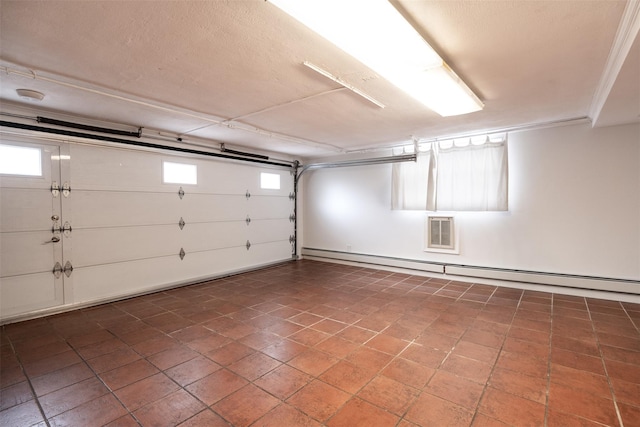 garage with a baseboard heating unit
