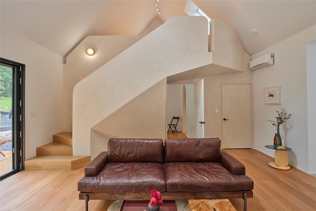 64 Hoyt Rd, Glen Spey, NY 12737 - living room with an AC wall unit, wood finished floors, high vaulted ceiling, and stairs