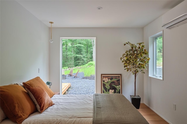 64 Hoyt Rd, Glen Spey, NY 12737 - bedroom featuring access to outside, wood finished floors, and a wall mounted AC