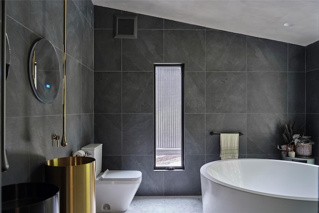 64 Hoyt Rd, Glen Spey, NY 12737 - bathroom featuring tile walls and a freestanding tub