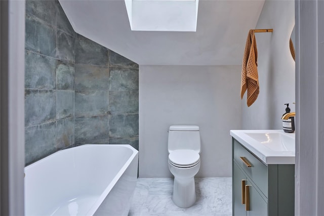 64 Hoyt Rd, Glen Spey, NY 12737 - bathroom featuring a freestanding bath, lofted ceiling, vanity, a skylight, and marble finish flooring