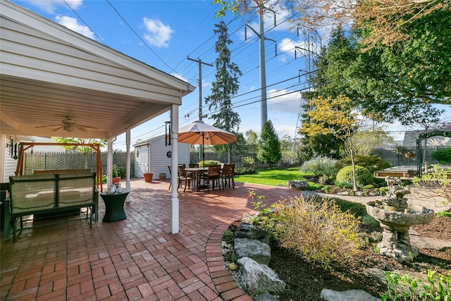 view of patio / terrace with outdoor dining space, a ceiling fan, and a fenced backyard