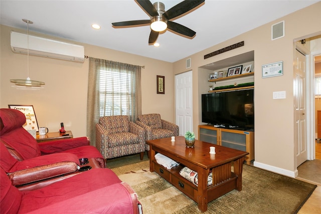 living area featuring a wealth of natural light, visible vents, ceiling fan, and an AC wall unit