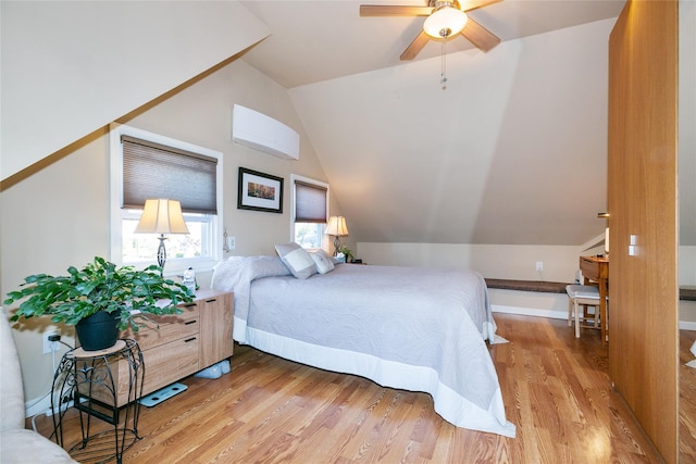 bedroom with wood finished floors, a ceiling fan, and vaulted ceiling