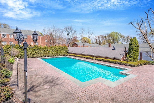 view of swimming pool featuring a fenced in pool and a patio area