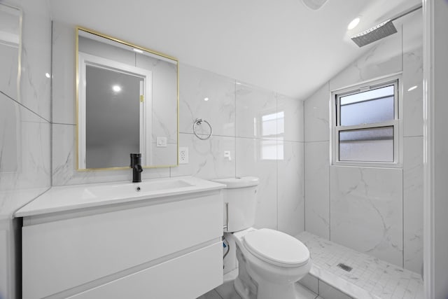 full bath with vaulted ceiling, toilet, vanity, and a marble finish shower