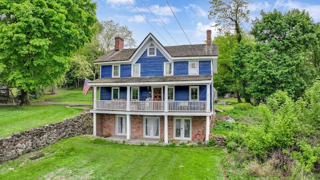 57 River Ave, Cornwall On Hudson, NY 12520 - view of front facade with french doors, a front yard, a chimney, and brick siding