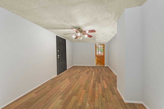 57 River Ave, Cornwall On Hudson, NY 12520 - unfurnished room with a ceiling fan, hardwood / wood-style floors, a textured ceiling, and baseboards