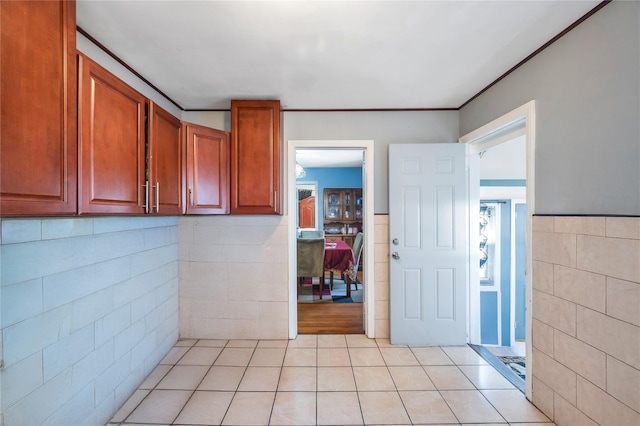 interior space featuring tile walls and tile patterned floors
