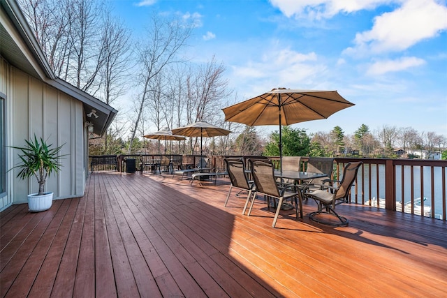 wooden deck featuring outdoor dining space