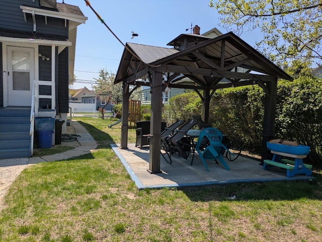 view of yard with fence, a gazebo, and a patio