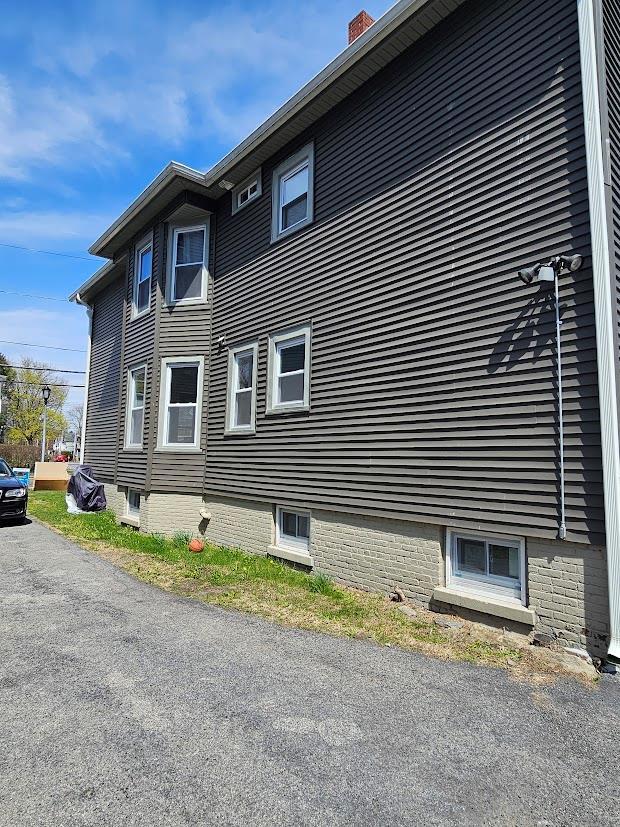 view of home's exterior featuring a chimney