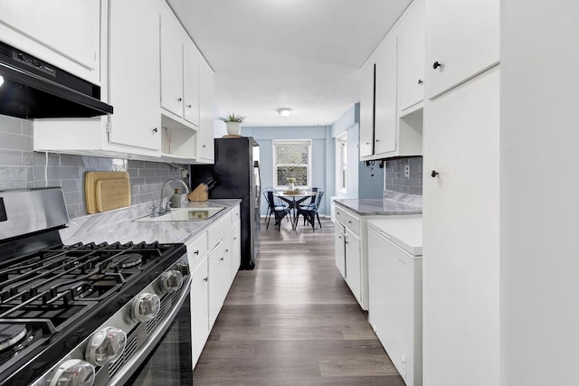 3130 Irwin Ave Unit 2C, Bronx, NY 10463 - kitchen featuring under cabinet range hood, light countertops, wood finished floors, a sink, and stainless steel gas range