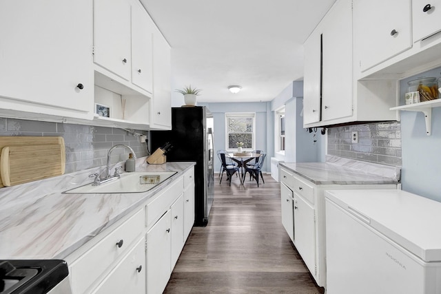 3130 Irwin Ave Unit 2C, Bronx, NY 10463 - kitchen with open shelves, light countertops, a sink, and tasteful backsplash