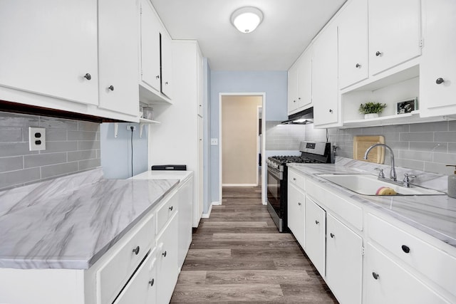 3130 Irwin Ave Unit 2C, Bronx, NY 10463 - kitchen with under cabinet range hood, open shelves, stainless steel gas range oven, and a sink