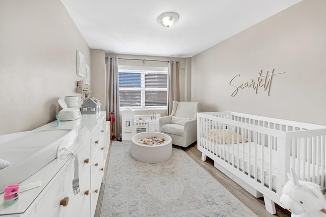 3130 Irwin Ave Unit 2C, Bronx, NY 10463 - bedroom with a nursery area and wood finished floors